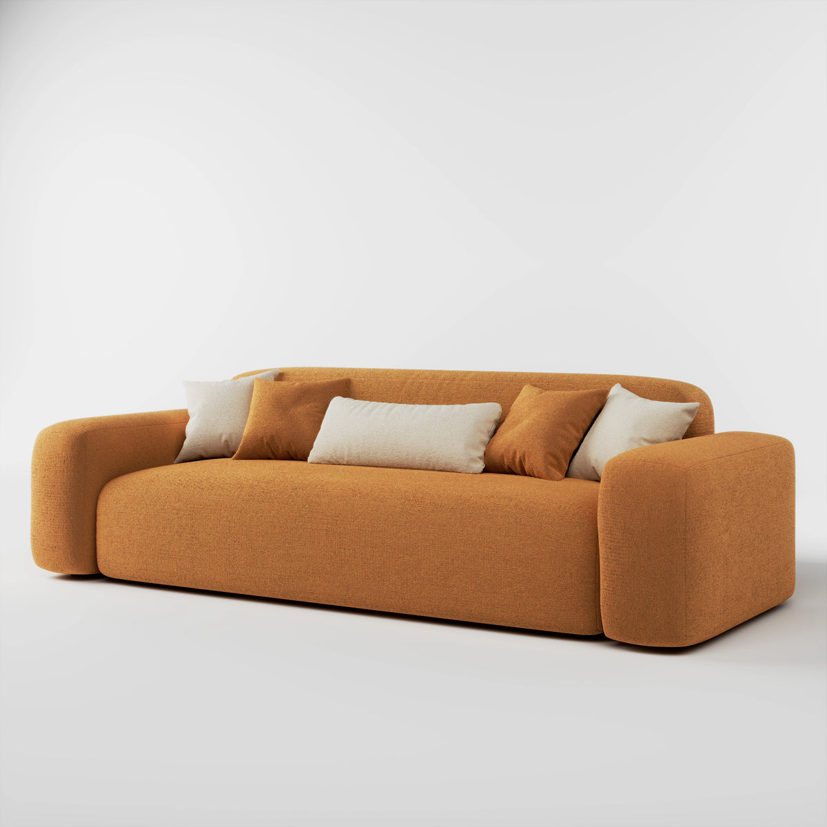 Cove 3 seater sofa in amber fabric with accent cushions, angled front view
