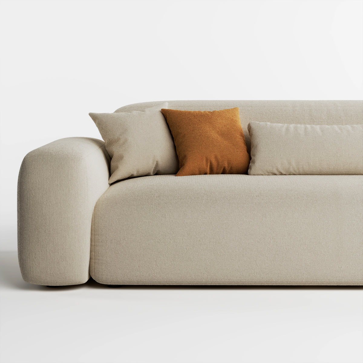 Close up of Cove 3 seater sofa in beige fabric showing armrest, seat, and cushions